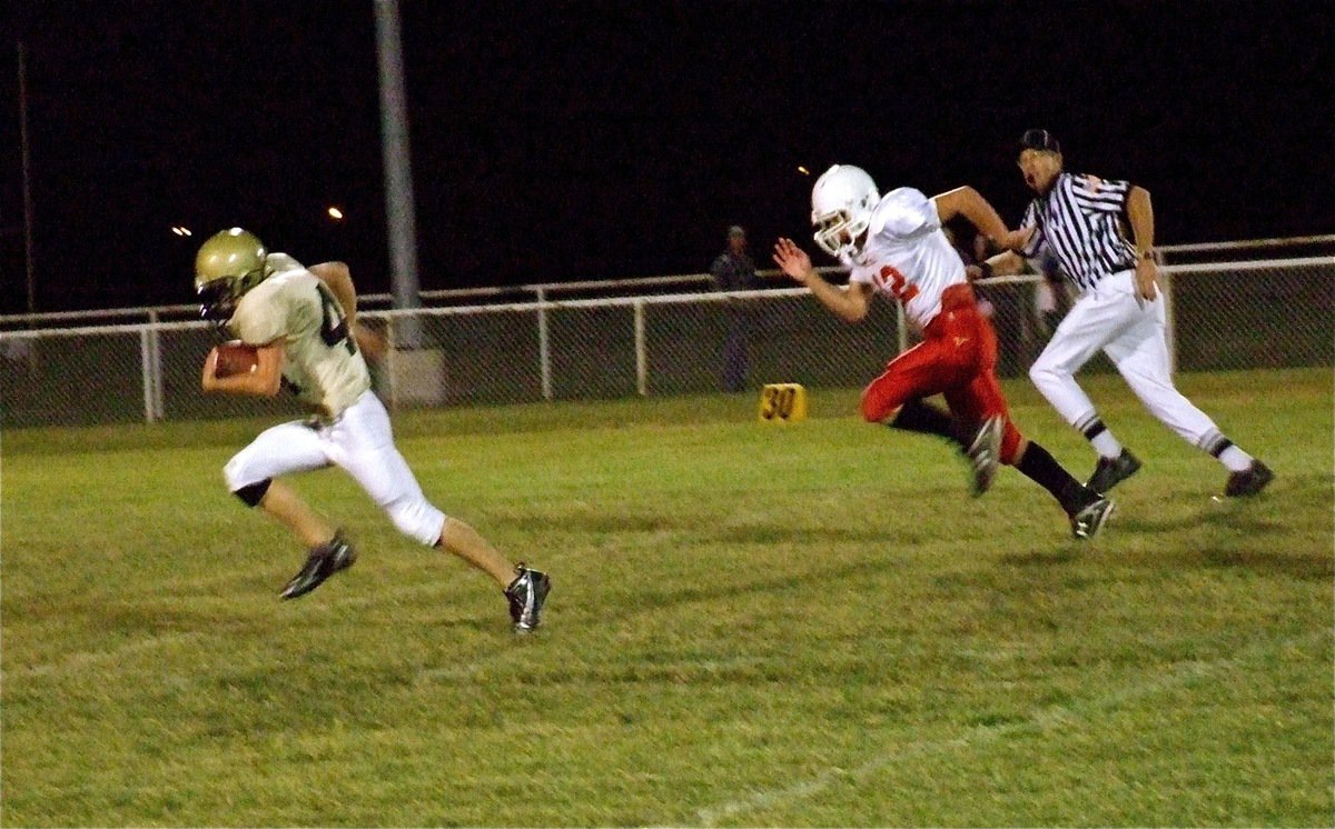 Image: Justin’s everywhere! — Justin Wood(44) scoops up a Longhorn fumble and heads for the endzone.