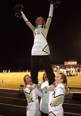 Image: Loud and proud — IHS Cheerleaders Mary Tate, Destani Anderson, Casandra Jeffords and Morgan Cockerham try to help the Gladiators rise over the Longhorns.