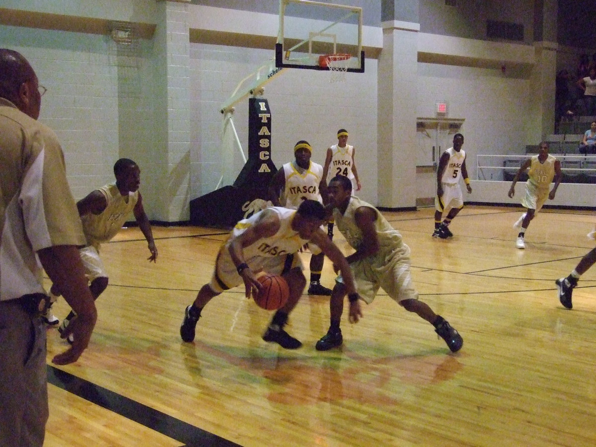 Image: Heath Combats — Coach Mayberry urges on his troops during the heated battle with Itasca.