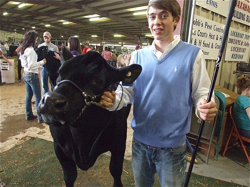 Image: Dan Crownover’s ready to show at the Ellis County Youth Expo — Dan Crownover showing an animal during the Expo was a frequent sight, always ready to lend a hand to his fellow Expo participants.