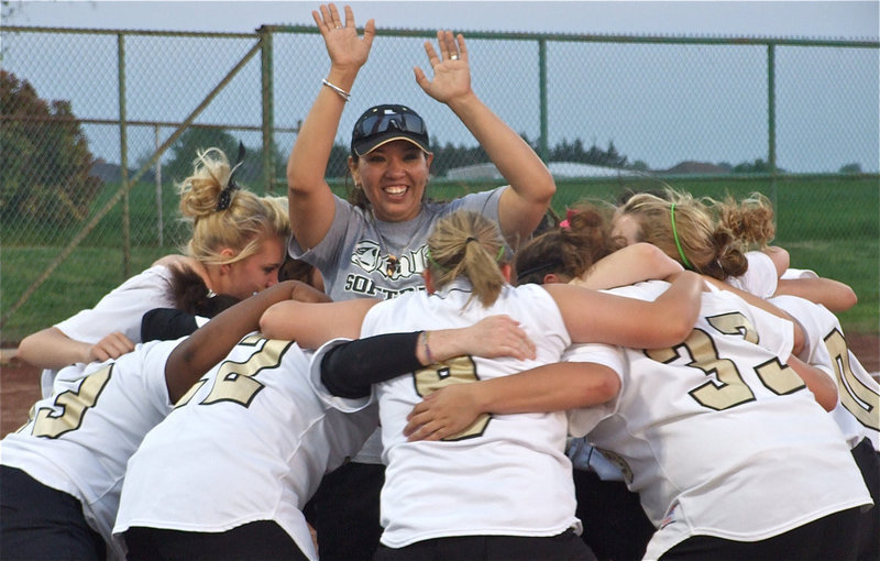 Image: The roof, the roof, the roof is on fire! — Coach Tina Richards celebrates with the Italy Lady Gladiators J.V. Softball Team after an impressive 14-8 victory over the Red Oak Lady Hawks J.V. on Monday.