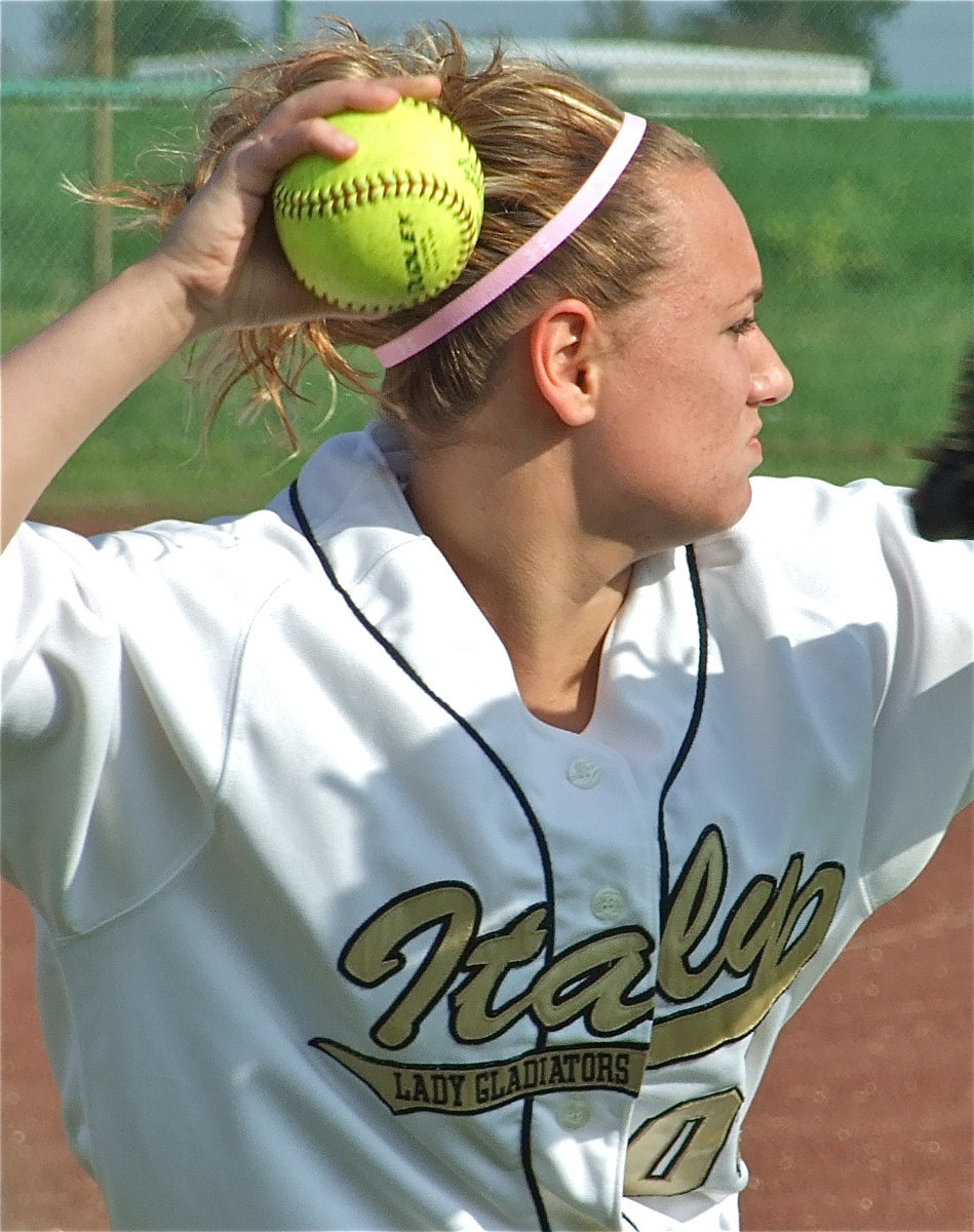 Image: What an arm! — Mary Tate pulled off the play of the game when she threw a Red Oak runner out at first base. Tate was playing deep in right field at the time.