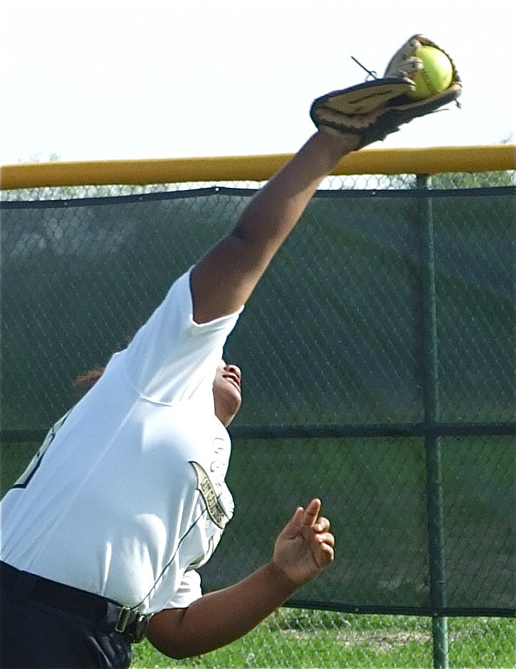 Image: Norwood stretches — Sa’Kendra Norwood just makes the grab.