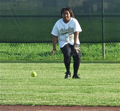 Image: On the ball — Left fielder Khadijah Davis goes after a grounder against Red Oak.