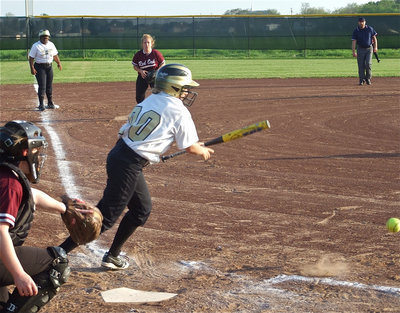 Image: Tate at the plate — Mary Tate gets an RBI with this swing scoring Sa’Kendra Norwood from third base.