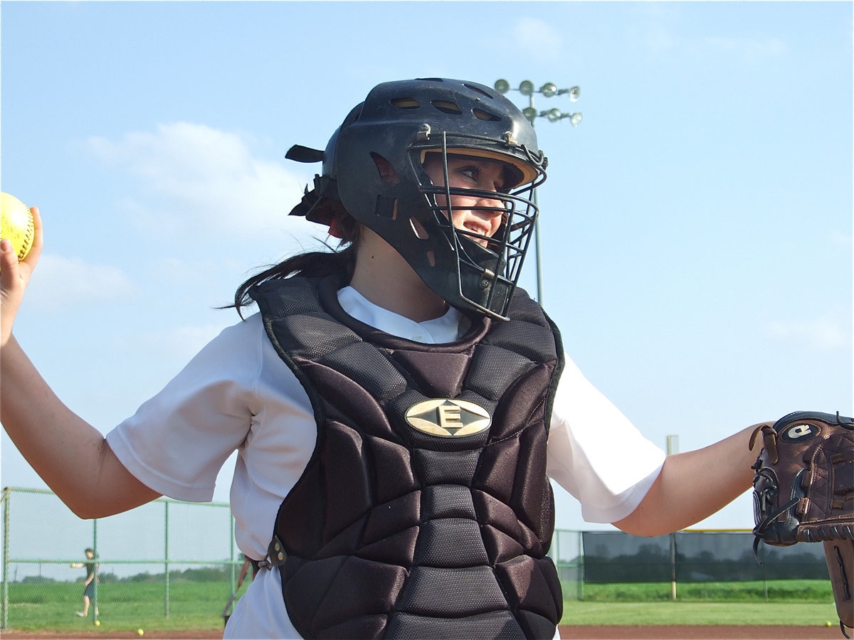 Image: Looking to throw — Catcher Breyanna Beets jumps up to her feets!