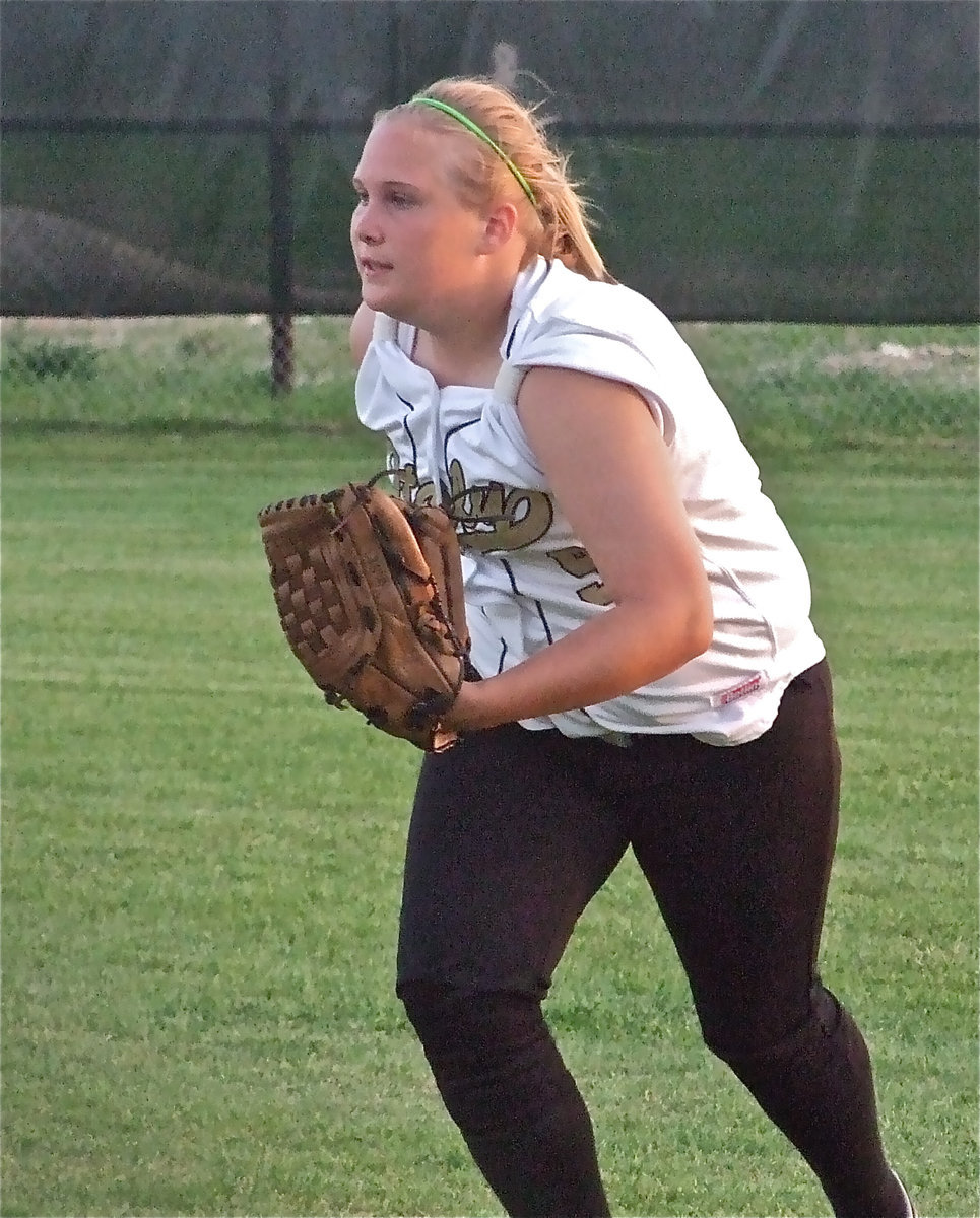 Image: Burk’s on the move — Drenda Burk hurries in from right field to back up a throw to first base.