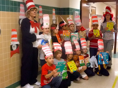 Image: Mrs. McCleskey’s First Graders — Ramona Simon, “Cat in the Hat” and Mrs. McCleskey pose with the first graders for pictures.