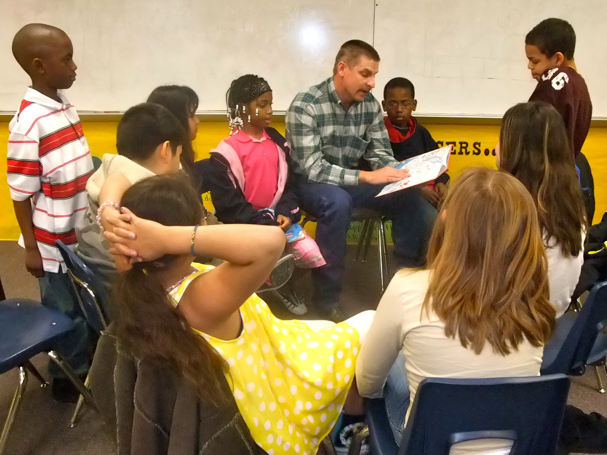 Image: Curtis Riddle — Curtis Riddle, school board member, is reading to Mrs. Cockran’s third grade class.