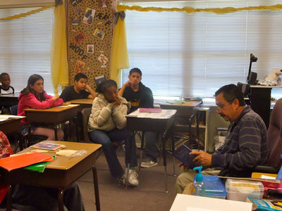 Image: Albert Garcia, Sr. — Albert Garcia, Sr. a community member reading to Mrs. Murphy’s fifth grade class.