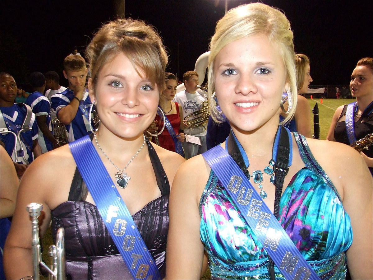 Image: Multitasking — 2010 Homecoming Queen Nominees Brittany Goss and Taylor Falzerano prepare to perform with the MHS Band during halftime.
