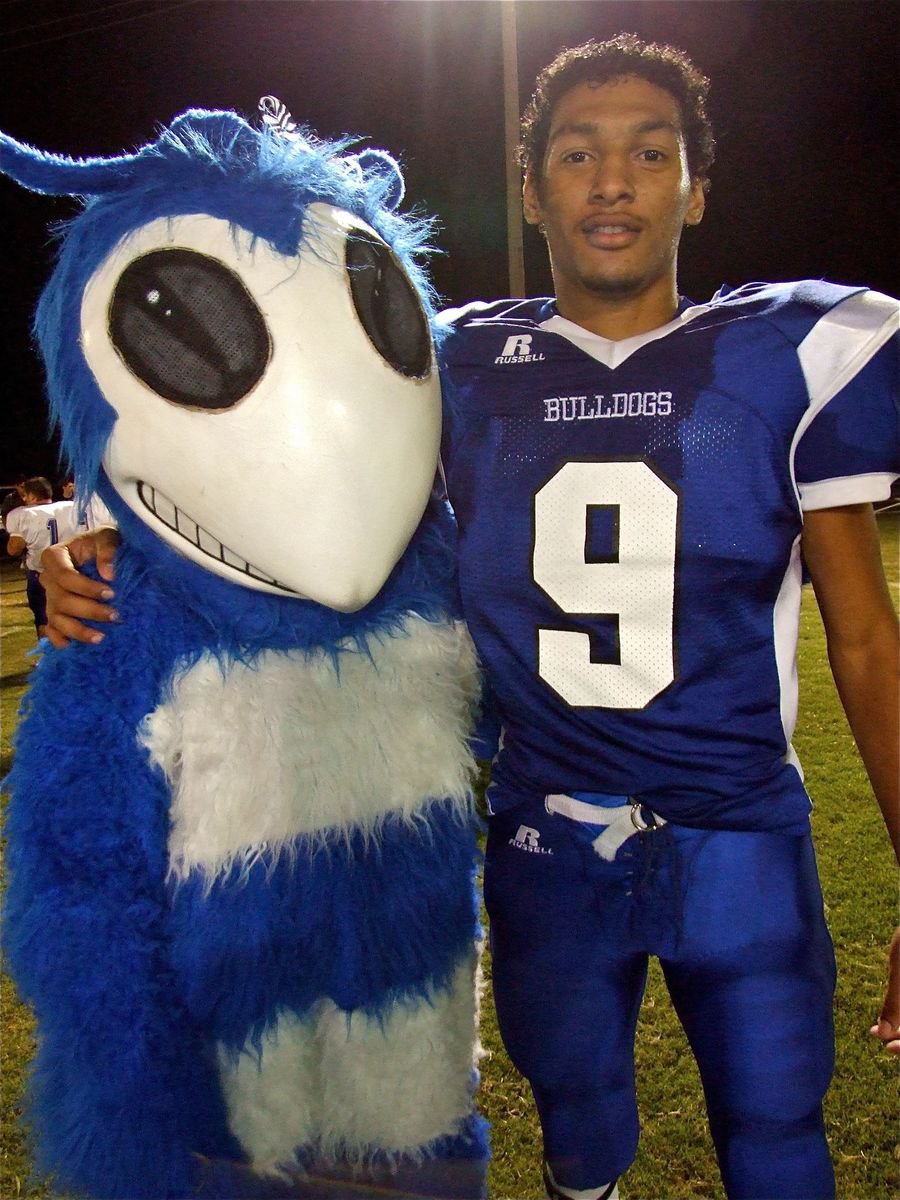 Image: No hard feelings — Although, the 52-6 loss to Milford still stings a bit if your a Hornet fan. The Walnut Springs mascot and Milford’s Dez Buckaloo honor the spirit of 6-man football.