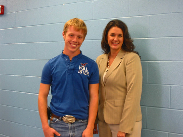 Image: Essay Winner — Josh Milligan and Navarro College Professor Jodi Price pose for a picture during the party honoring Josh’s Essay Contest win.