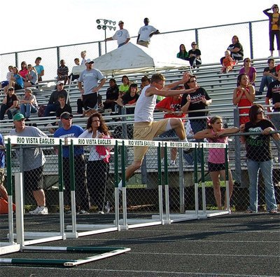 Image: Holden goes for it — Italy junior, Jase Holden, gives the 110 meter hurdles a try.