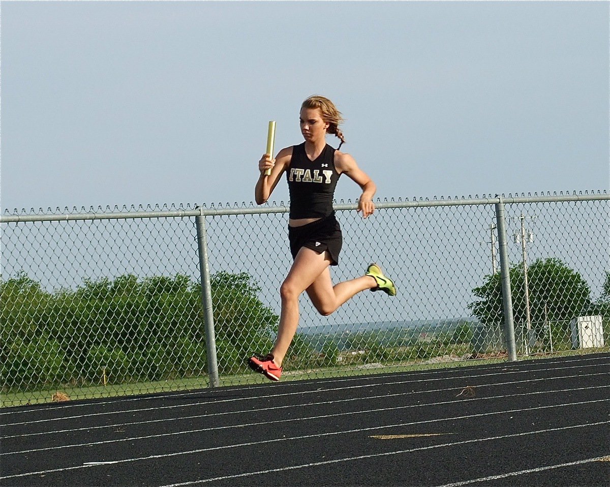 Image: Sierra Harris — Sierra Harris runs the second leg of the Italy JV girls 400 meter relay team. Harris, Anna Viers, Paola Mata and Jameka Copeland finished the event in 1st place.