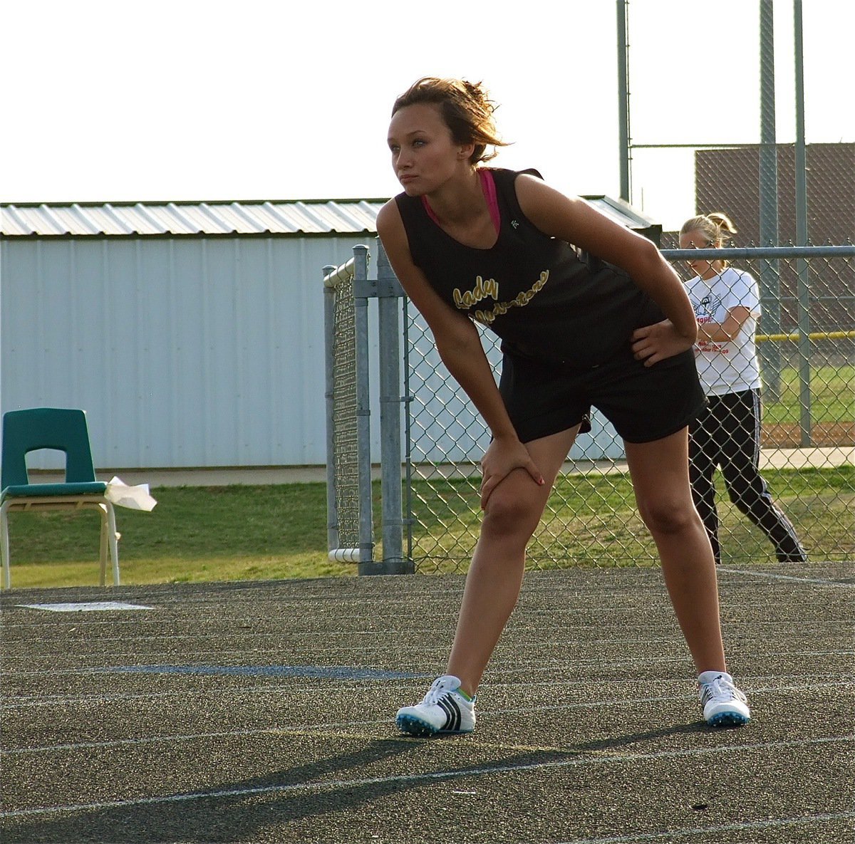 Image: Intensity — Courtney Russell gets set to run the JV girls 400 meter dash for the Lady Gladiators.