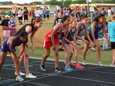 Image: Inner strength — Despite a sore knee, Kaitlyn Rossa (second from the left) pushes herself to compete in the 1600 meter run.