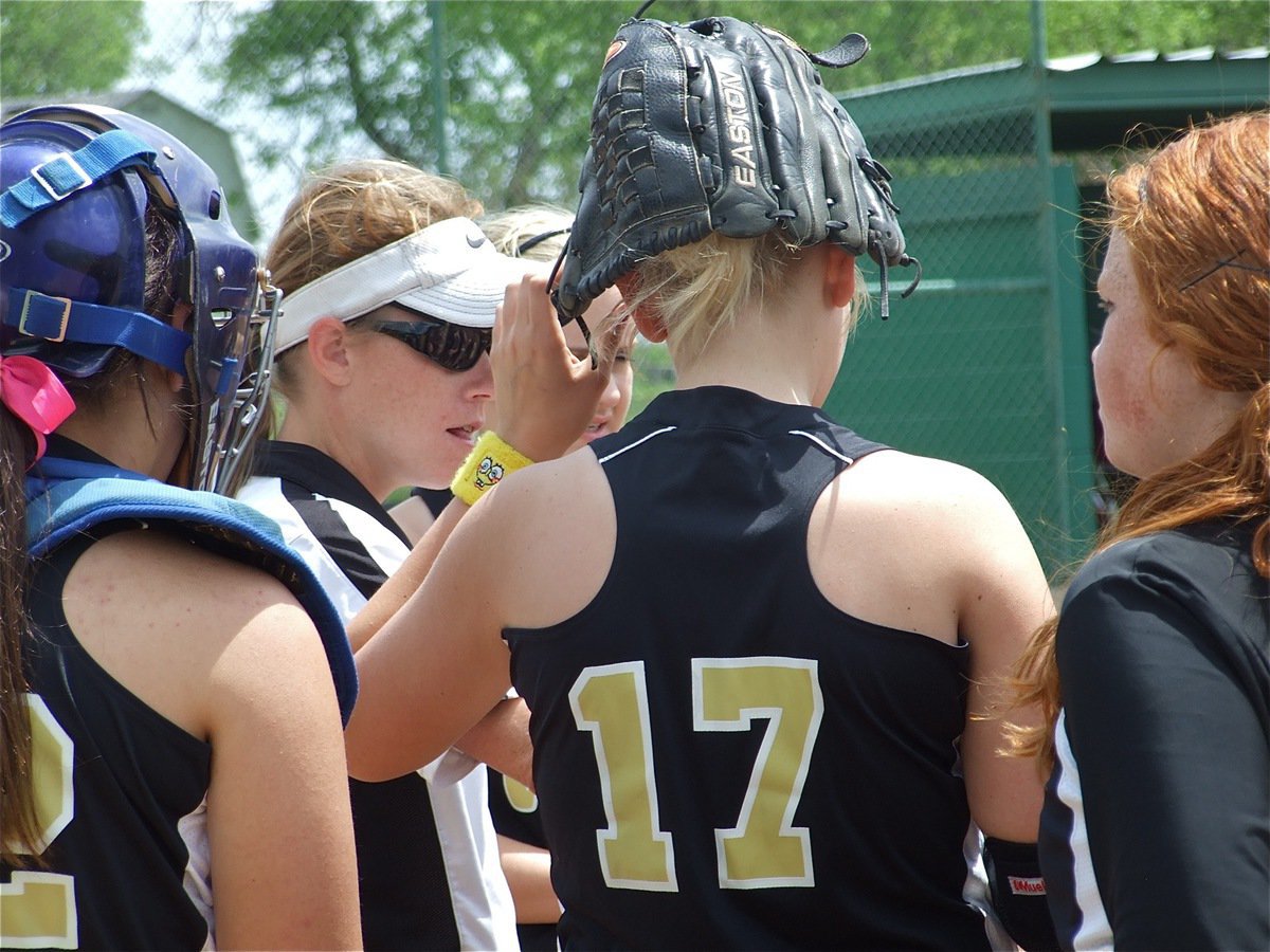 Image: Keep battling — Coach Jennifer Reeves keeps her girls loosened up after the game tightened up 3-3.