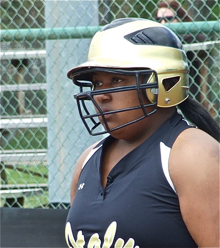 Image: Khadijah keeps focus — Khadijah Davis gets the sign from coach Jennifer Reeves at third base.