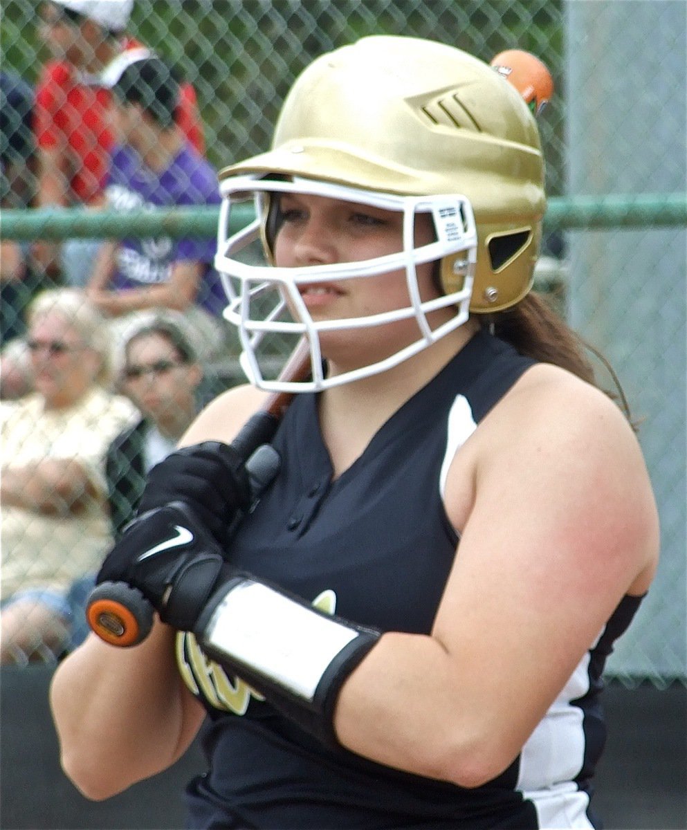 Image: Mildred backs up — Cori Jeffords checks in with Coach Jennifer Reeves before stepping into the batter’s box.