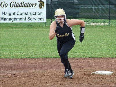 Image: Be afraid — Cori Jeffords powers her way to third base.