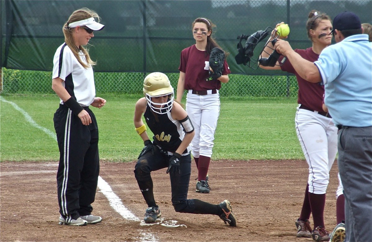 Image: Safe at third — Coach Jennifer Reeves breaks a smile after Drew Windham slides safely into third base.