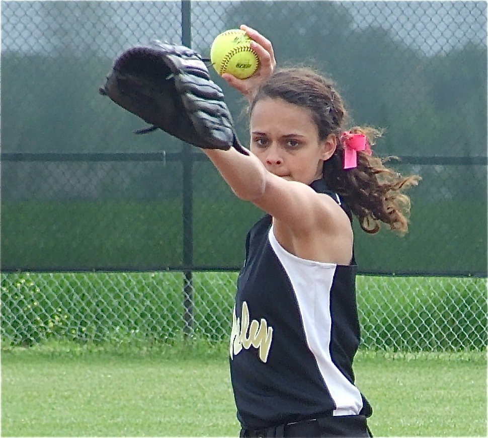 Image: Anna aims — Shortstop Anna Viers throws to first base.