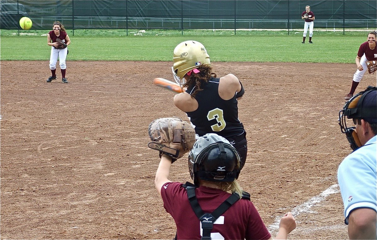 Image: Viers drives the ball — Anna Viers drives a single past Mildred’s shortstop.