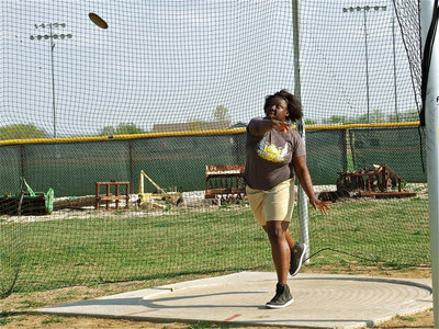 Image: Reed enters circle — Italy’s Jimesha Reed let’s it fly during the discus event.