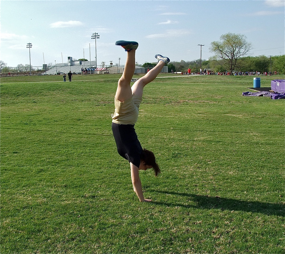 Image: Not an event — But it should be! Kaytlyn Bales summersaults her way to the field events.