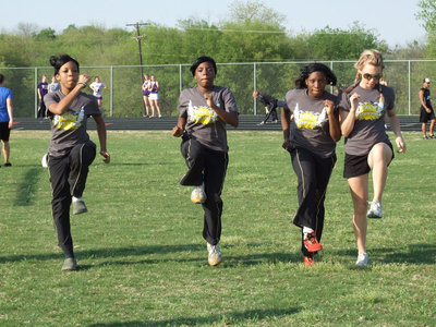 Image: Stepping it up — Ryisha Copeland, Kendra Copeland, Jameka Copeland and Sierra Harris get ready to run.