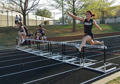 Image: How it’s done — Taylor Turner takes 1st place, Bailey Bumpus takes 2nd place and Imke Klindworth finishes in 4th place during the 100 meter hurdles.