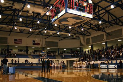 Image: Under the big “M” — Italy’s players, coaches, cheerleaders and fans stand for the playing of the National Anthem inside Midlothian’s gymnasium.