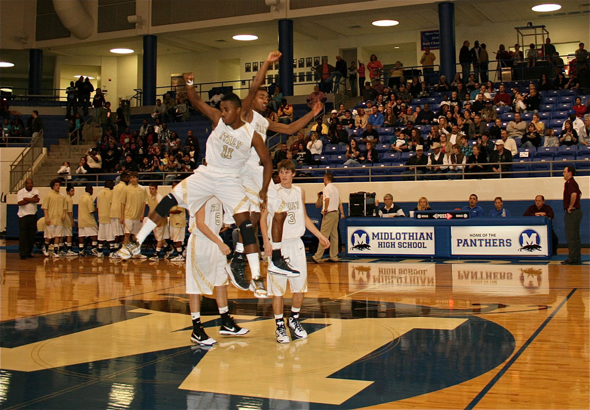 Image: Pre-game introductions — Jasenio Anderson(11) and teammate Heath Clemons(2) get ready to go for a win over Mildred.