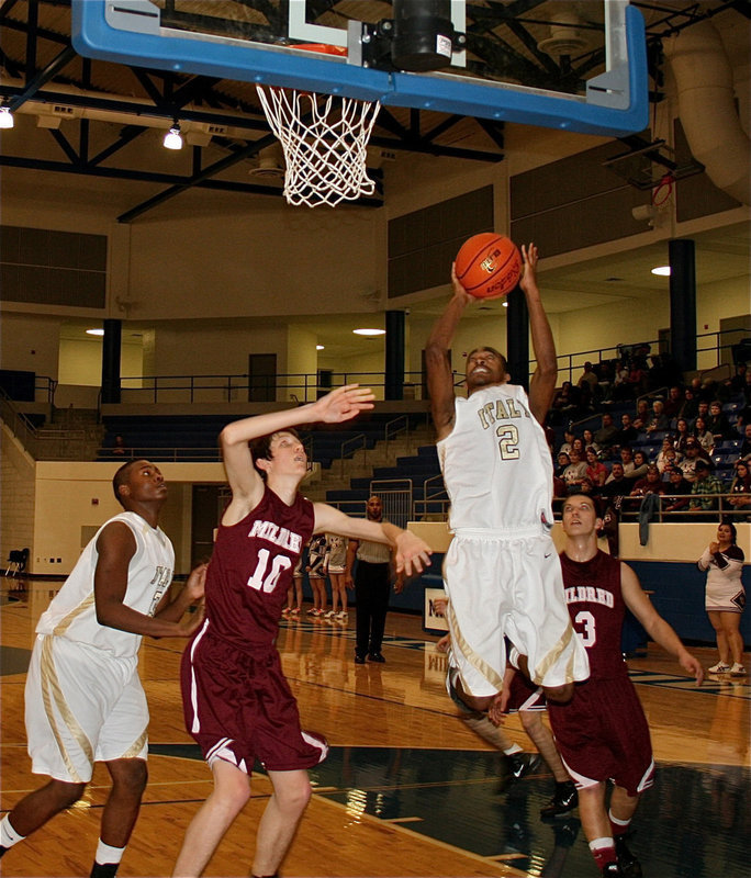 Image: 2 for two — Senior Heath Clemons(2) jump stops and scores for the Gladiators to finish with 8-points on the night.