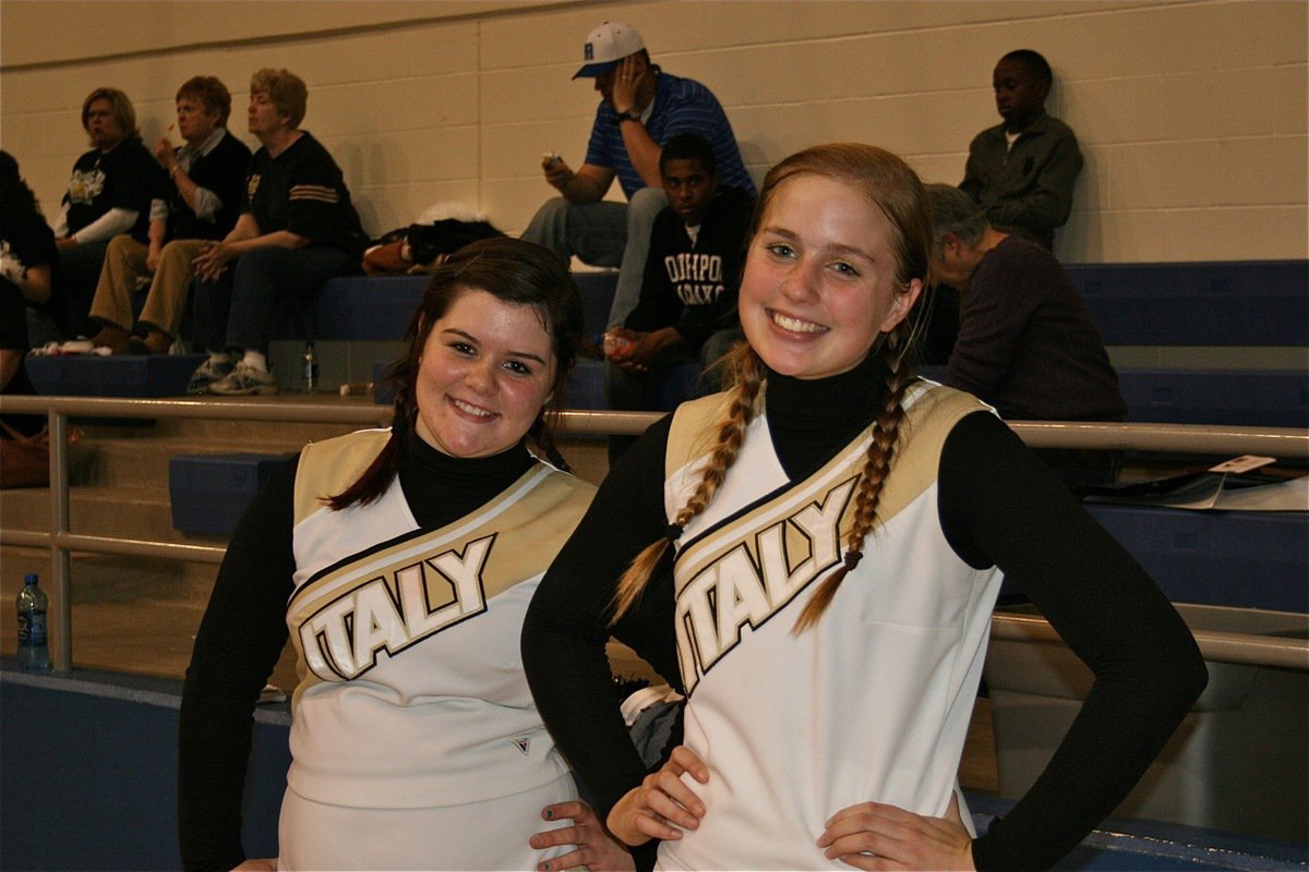 Image: 8th Graders cheer  — Italy Junior High Cheerleaders Bailey DeBorde and Madison Washington help the varsity cheer squad keep Italy’s fans cheering.