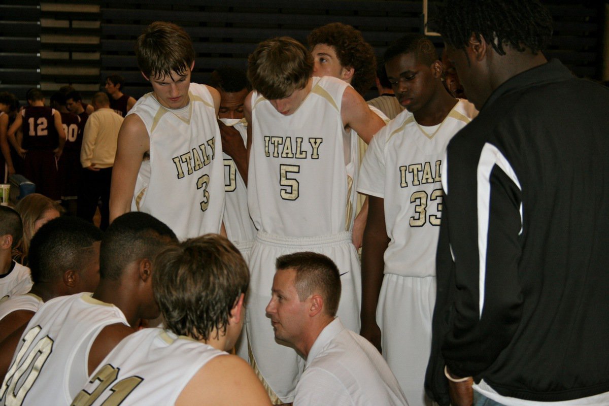 Image: This one’s in the basket — Gladiators head coach Aidan Callahan huddles with the team during a fourth-quarter timeout.