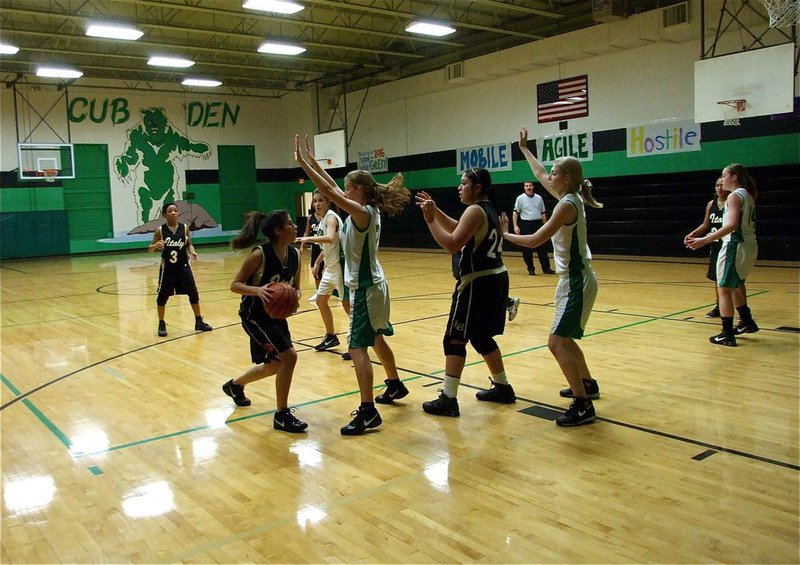 Image: Alma with the ball — Alma Suaste(32) attempts to make a pass into teammate Monserrat Figueroa(24).