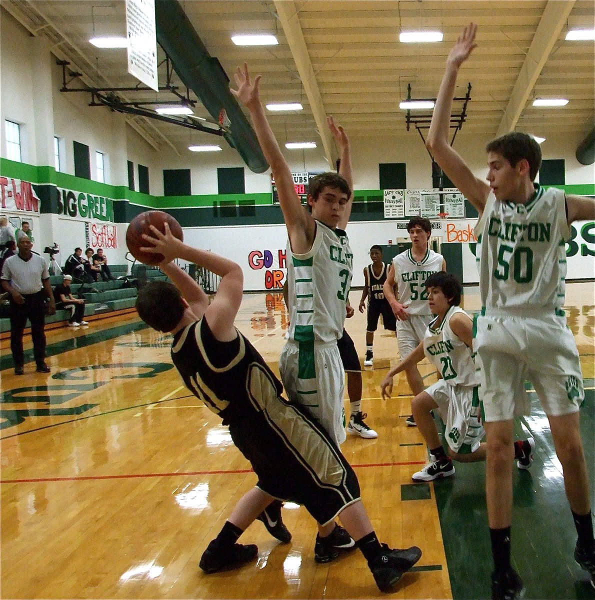 Image: No strings attached — Jake Escamilla(11) defies the law of gravity and passes out to a teammate during the JV Boys game between Italy and Clifton.