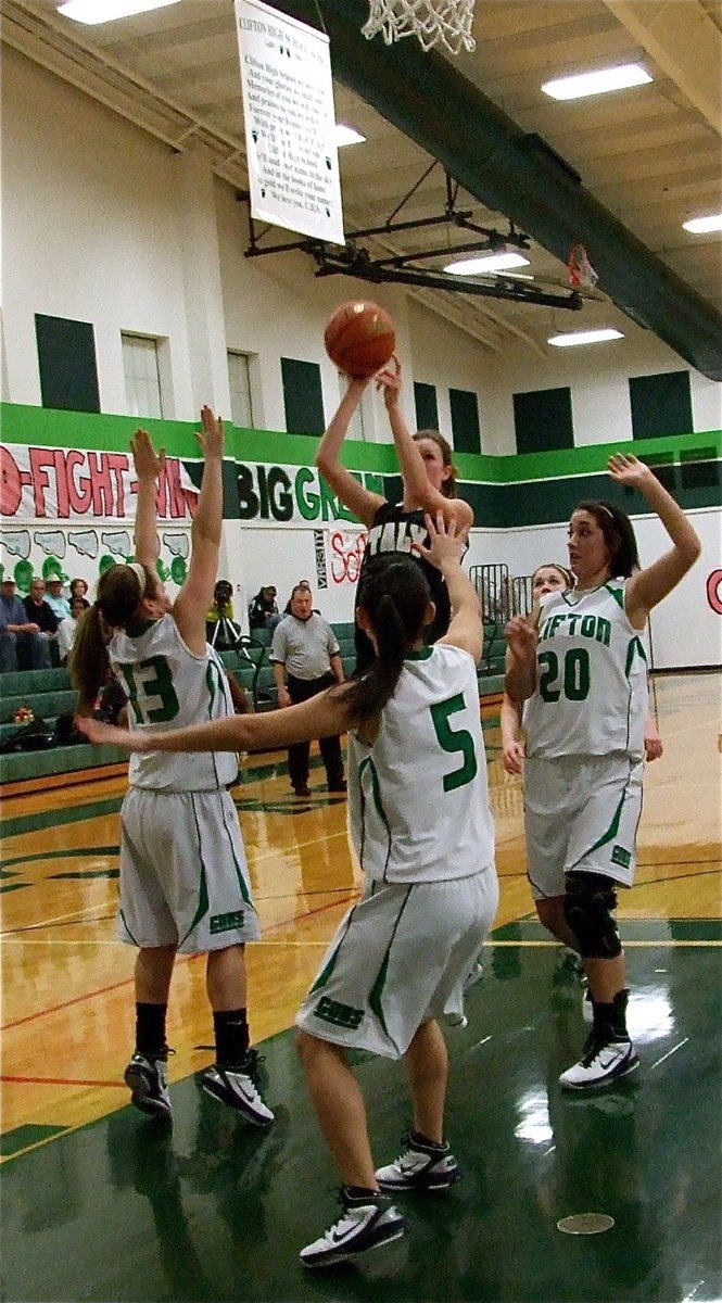 Image: Rossa’s unfair — Lady Gladiator Kaitlyn Rossa(3) gets the shot away despite triple coverage by Clifton.