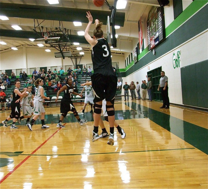 Image: Swishes jersey number — Lady Gladiator Kaitlyn Rossa(3) swishes this three-pointer from the corner.