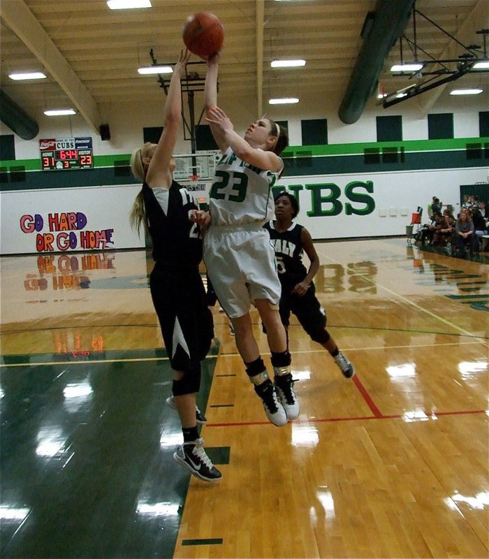 Image: Megan defends — Lady Gladiator Megan Richards(22) applies pressure to a Lady Cub shooter.