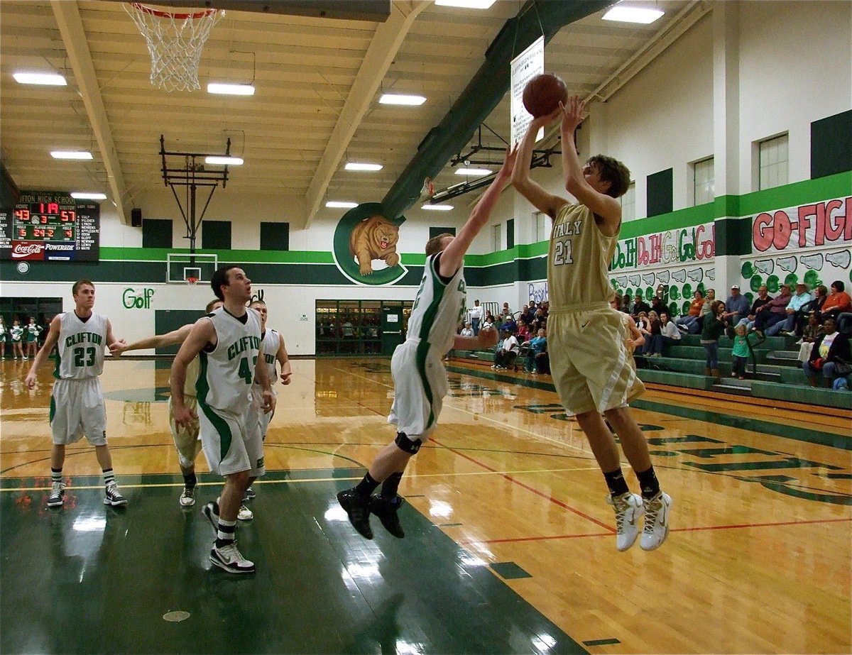 Image: Cole scores easily — Italy’s Cole Hopkins(21) rises for a jump shot over a Clifton defender to score two of his six-points.