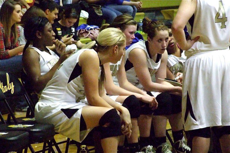 Image: The Lady Gladiators catch a breather while getting the play — Lady Gladiators Megan Richards, Jameka Copeland, Kaitlyn Rossa, Bailey Bumpus and Keyonne Birdsong get the game plan from head coach Stacy McDonald during their game against Whitney.