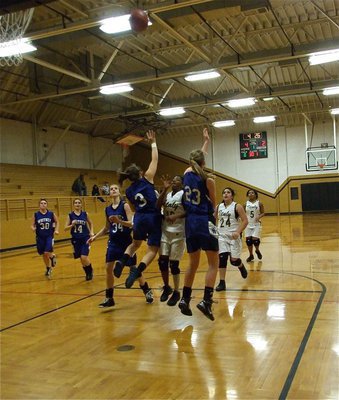 Image: Amazing shot — Italy’s point guard Kendra Copeland(10) squeezes thru two JV Lady Wildcat defenders to score this basket.