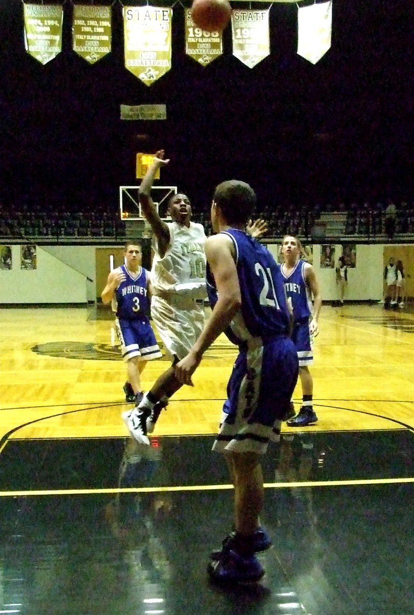 Image: Into the lane — Italy’s point guard Eric Carson(10) lofts in a score against the Whitney JV Wildcats.