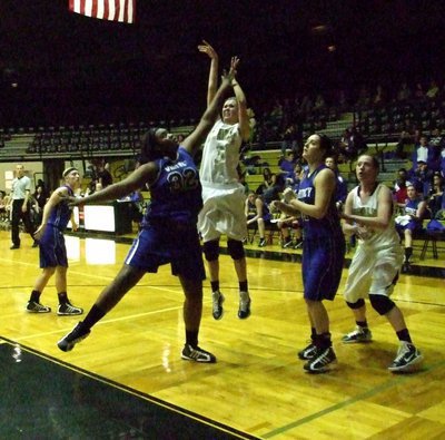 Image: Three for two — Kaitlyn Rossa(3) takes a jumper during the Varsity girls game between Italy and Whitney.