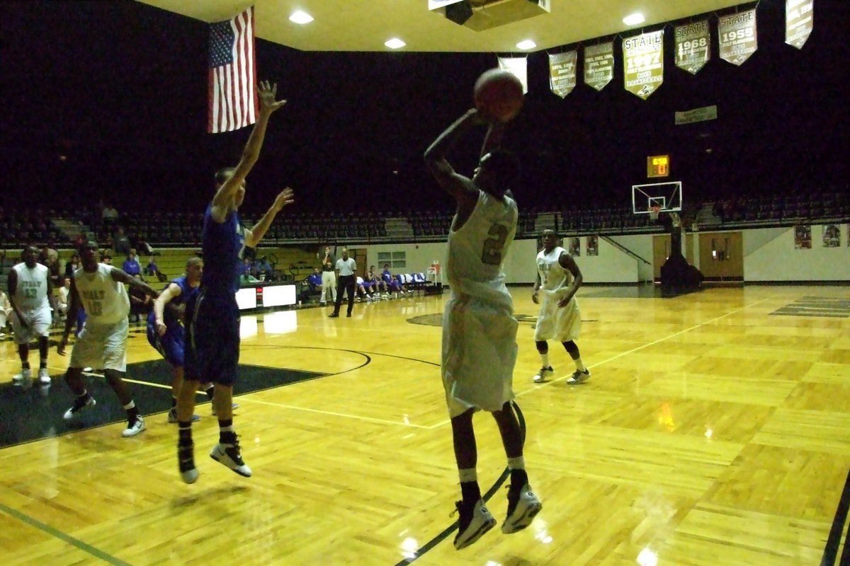 Image: Two for three — Heath Clemons(2) receives the pass from Jasenio Anderson(11) and then swishes a three-pointer from the corner.