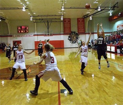 Image: Keep shooting — Megan Richards(22) launches a three-pointer for the Lady Gladiators.