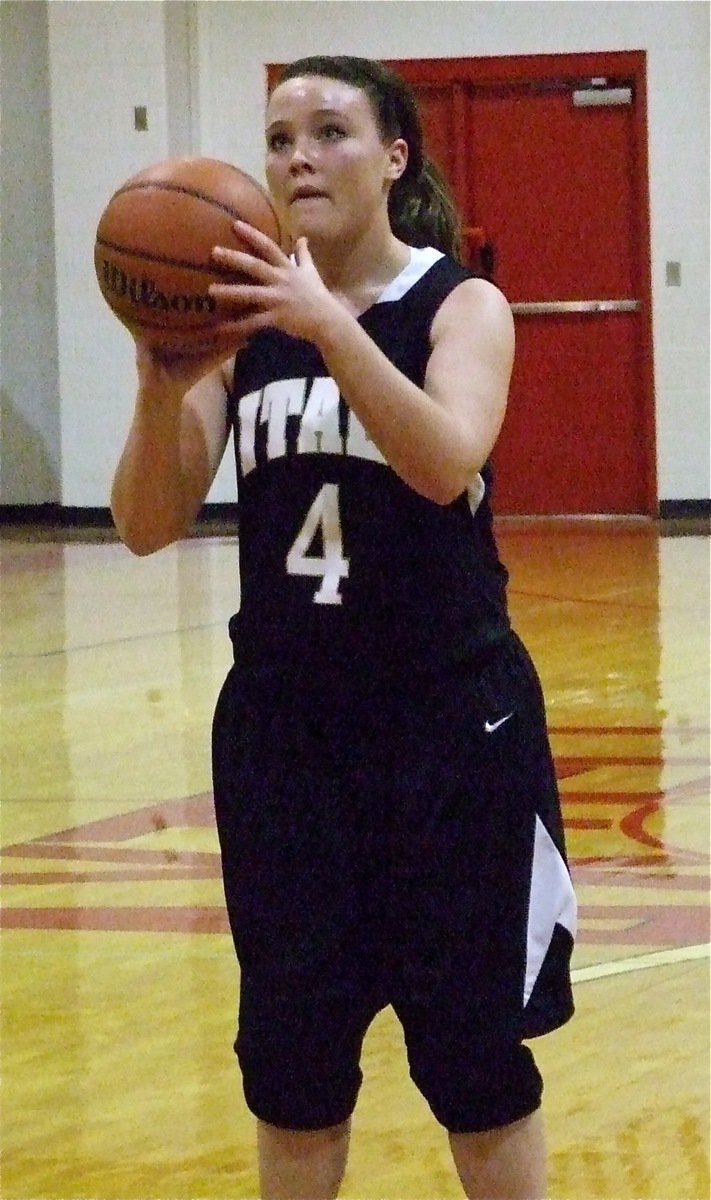 Image: At the line — Italy’s Shelbi Gilley(4) concentrates before knocking down a free-throw.